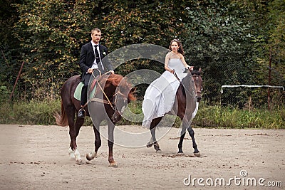 Wedding couple on horses