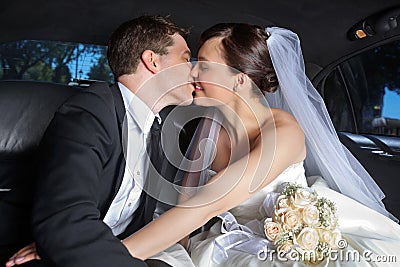 Wedding Couple Kiss in Limo