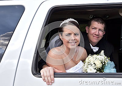 Wedding couple in Limousine