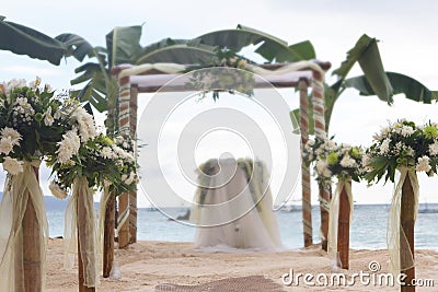 Wedding flower arch, post and decoration on beach