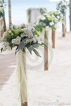 Wedding flower post on beach