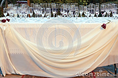 Wedding table outside with empty glasses