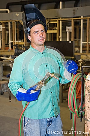 Welder on Factory Floor