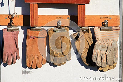 Well-worn heavy leather work gloves