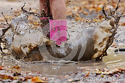 Wellington boots in puddle