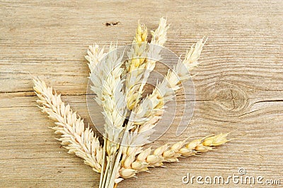 Wheat sheaf on wood