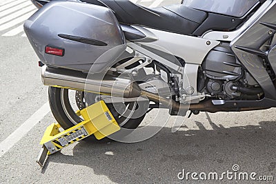 Wheel lock on an illegally parked motorcycle