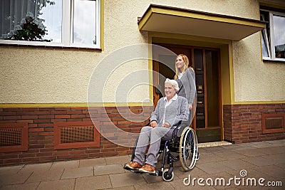 Wheelchair user in front of nursing