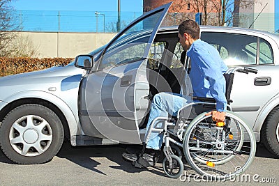 Wheelchair user getting into a car