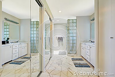 White bathroom with mirror slide doors