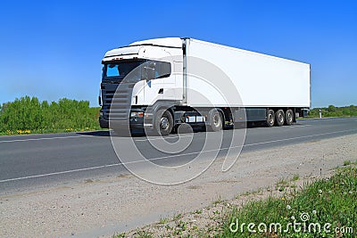 A White Big Tractor Trailer Truck with semitrailer