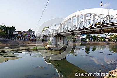 White bridge with low level river in Lampang, Thailand
