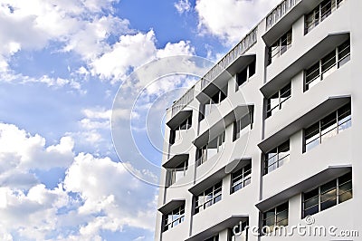 White Building, Blue Sky with Clouds