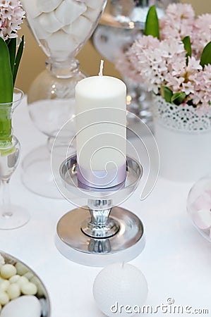 White candle with silk ribbon