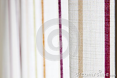 White curtain with yellow and purple stripe