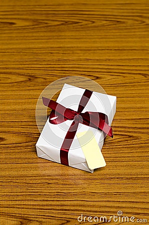 White gift box and red ribbin with tag