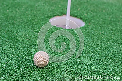 White golf ball on golf course