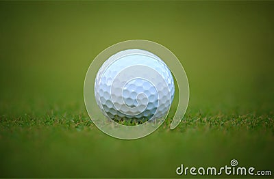 White golf ball on grass