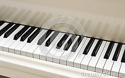 White grand piano keyboard