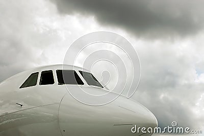 White Jet Cockpit and storm clouds