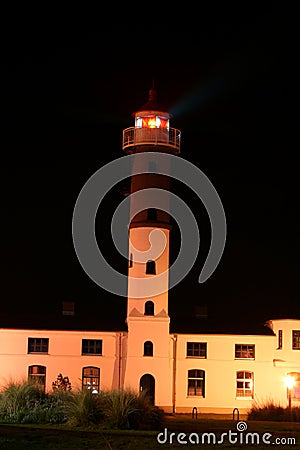 White Lighthouse Building at Night.