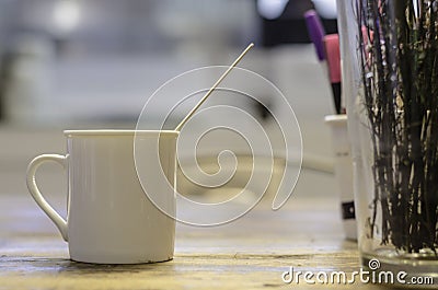 White mug on wooden table