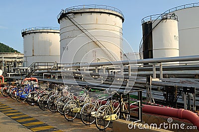 White Oil Tanks and bicycles parking in Chonburi, Thailand