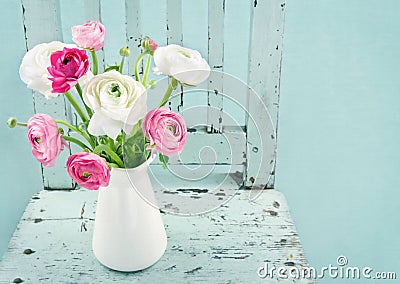 White and pink flowers on light blue chair