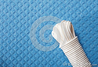 White plastic rope on blue background