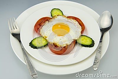 White porcelain dish, delicious breakfast and knife and fork