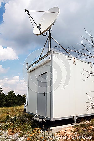 White satellite plate antenna of observation station