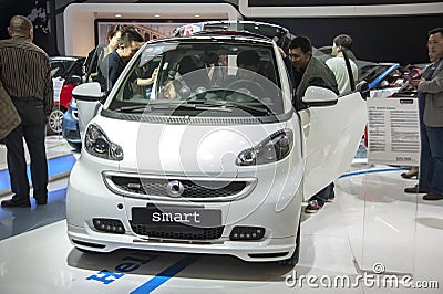 White smart car opened door