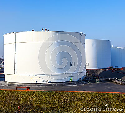 White tank in tank farm with blue