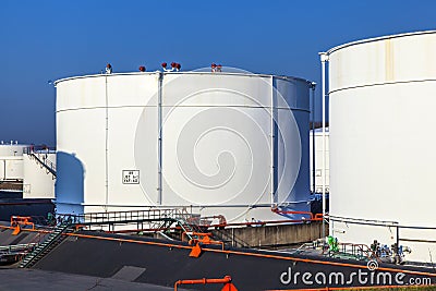 White tank in tank farm with blue