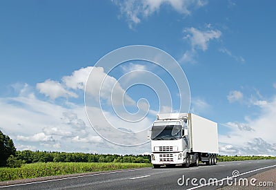 Royalty Free Stock Photos: White truck on country highway under blue 