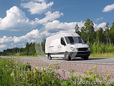 White van on summer rural highway