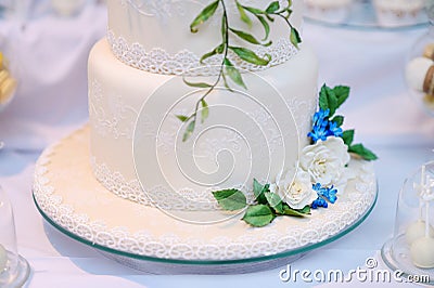 White wedding cake decorated with flowers