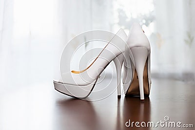White wedding shoes for women on the floor