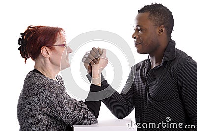 White woman and black man doing arm wrestling
