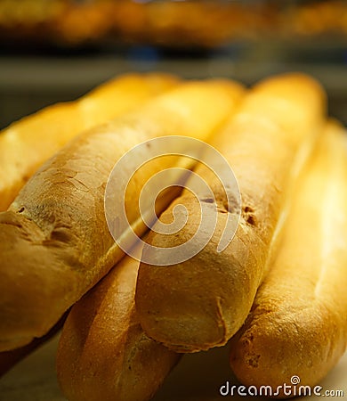 Whole Loaves of French Bread in a Bakery