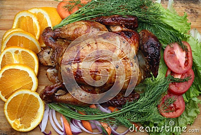 Whole roasted chicken with fresh vegetables