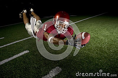 Wide Receiver Making a Diving Catch