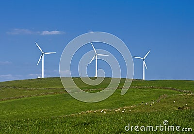 Wind turbines farm on the hills in Wales, UK. Alternative energy