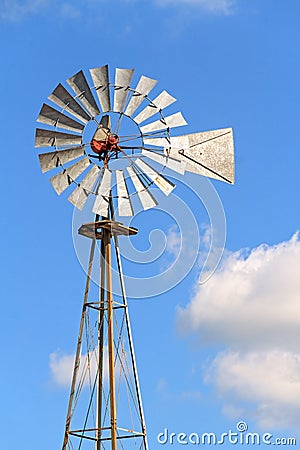 fashioned windmill, typically used on farms and ranches to pump water 