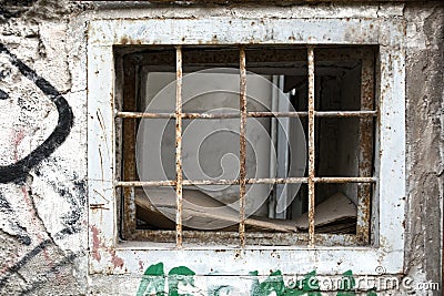 Window with rusted bars