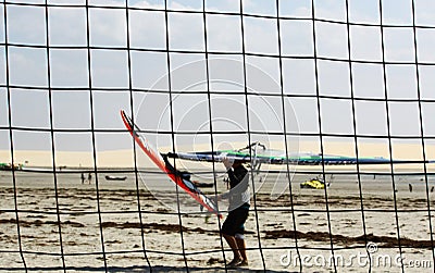 Windsufer through volleyball net