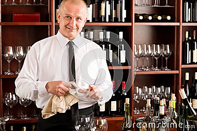 Wine bar waiter clean glass in restaurant