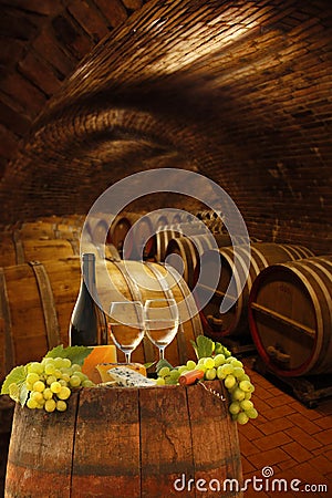 Wine cellar with glasses of white wine