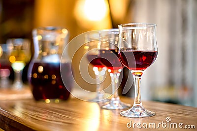Wine glasses with carafe and champagne at dinner party