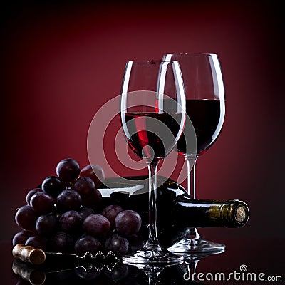 Wine in glasses with grape and bottle
